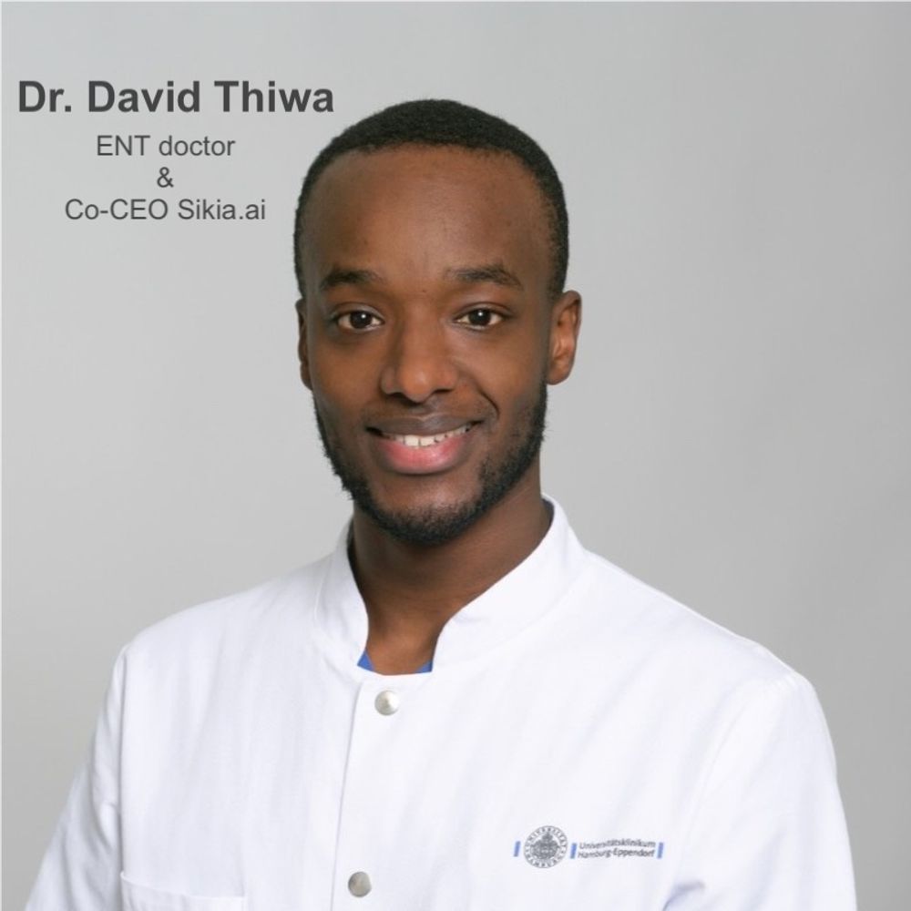 Here is a clear, accessible alt text you can use:

**Alt text:**
*Portrait photo of Dr. David Thiwa, an ENT doctor and Co-CEO of Sikia.ai. He is smiling and wearing a white medical coat with a hospital logo on the chest, standing in front of a light grey background. Text on the image reads: “Dr. David Thiwa – ENT doctor & Co-CEO Sikia.ai.”*
